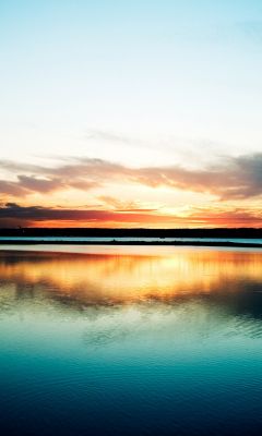 Reflet Éblouissant du Coucher de Soleil